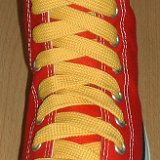 Fat (Wide) Gold Shoelaces on Chucks  Red high top with fat gold shoelaces.