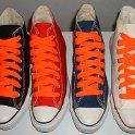 Fat (Wide) Neon Orange Shoelaces on Chucks  Core color high top chucks with fat neon orange shoelaces.