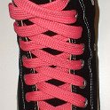 Fat (Wide) Neon Pink Shoelaces on Chucks  Black high top chuck with fat neon pink shoelaces.
