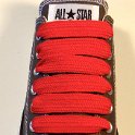 Extra Fat Laces on Low Top Chucks  Charcoal grey low top chuck with red extra fat shoelaces.