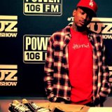 YG  YG showing off a pair of blacklow top chucks while visiting Power 106 in LA.